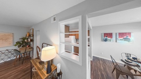 a dining room with a table and chairs and a window