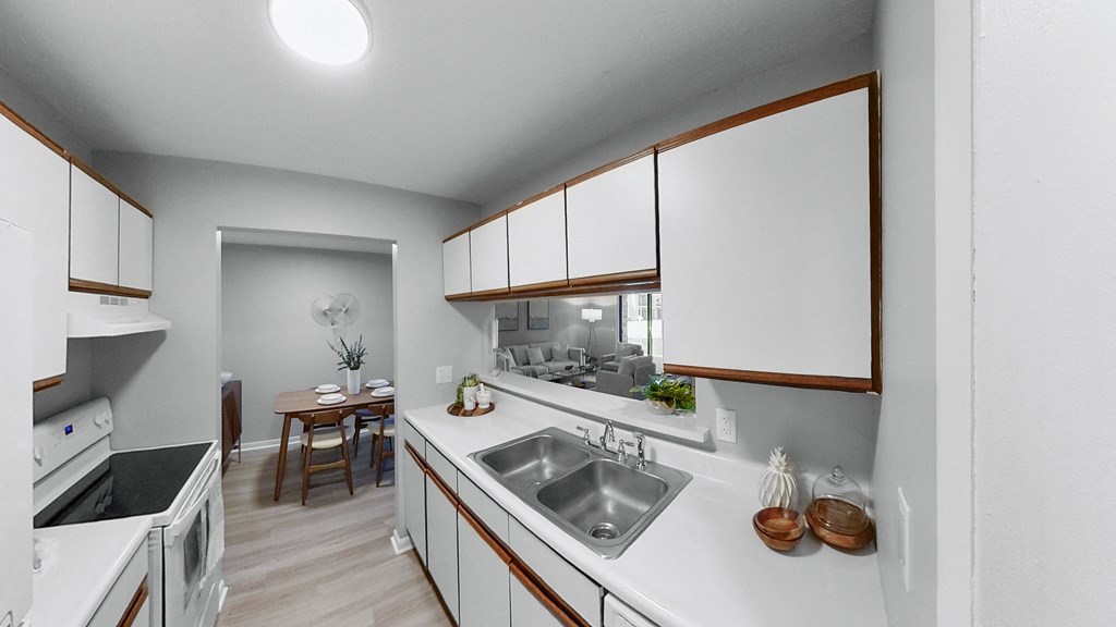 a kitchen with white counter tops and a stainless steel sink at The Element @ St Andrews, Indiana, 46545