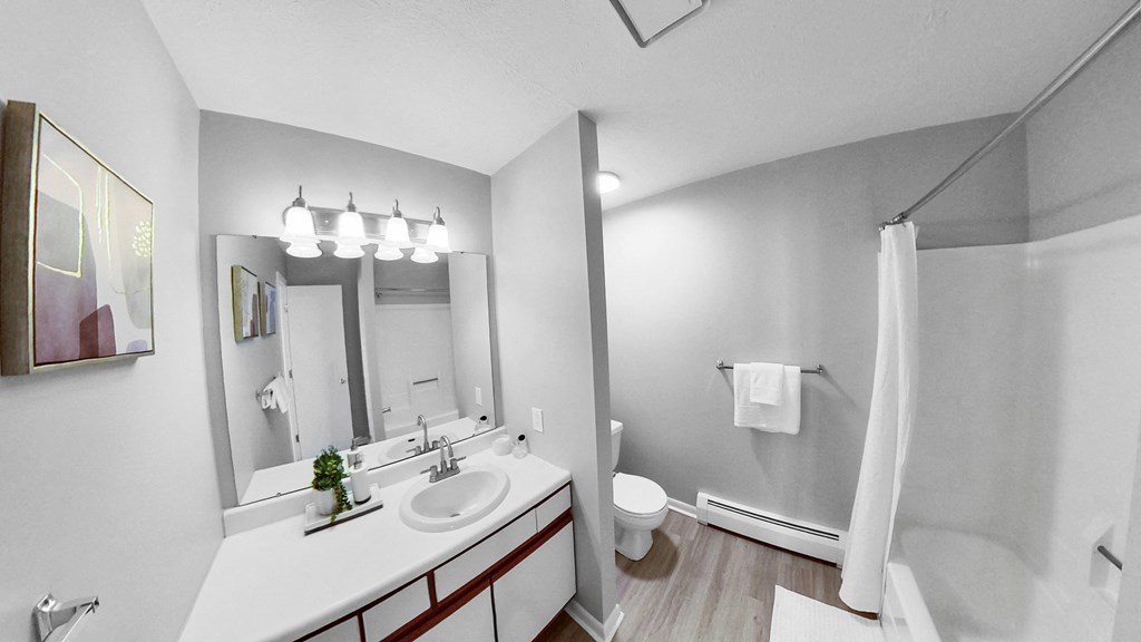 a bathroom with a sink and a shower and a toilet at The Element @ St Andrews, Mishawaka, Indiana