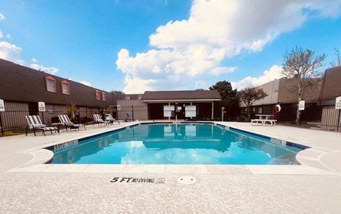 a swimming pool in front of a building