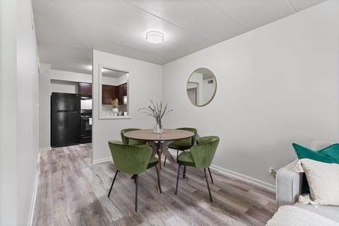 a dining room with a table and chairs
