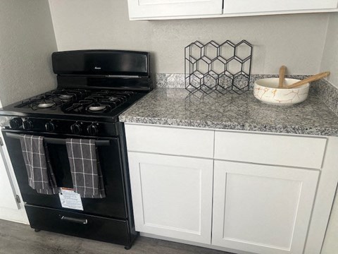 a small kitchen with a stove and a counter top