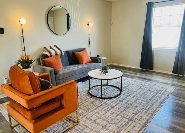 a living room with a couch and a coffee table at La Bella Apartments, Fort Worth, 76116