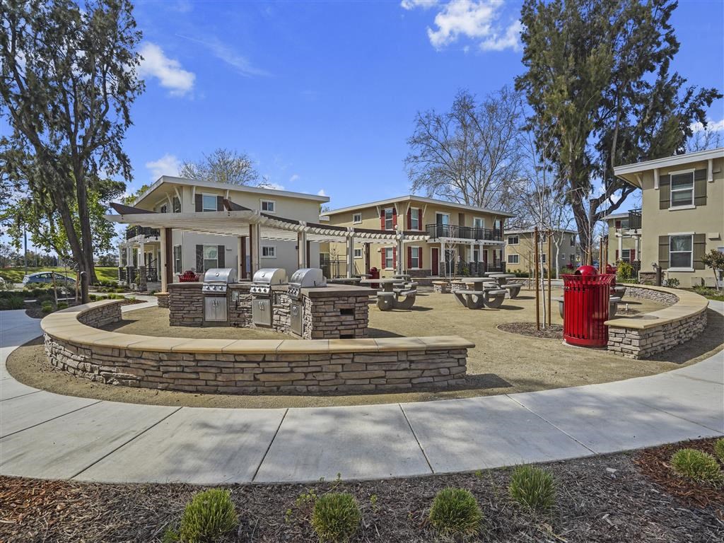 Tan sitting wall surrounding BBQ area at Parkside Apartments, Davis, CA, 95616