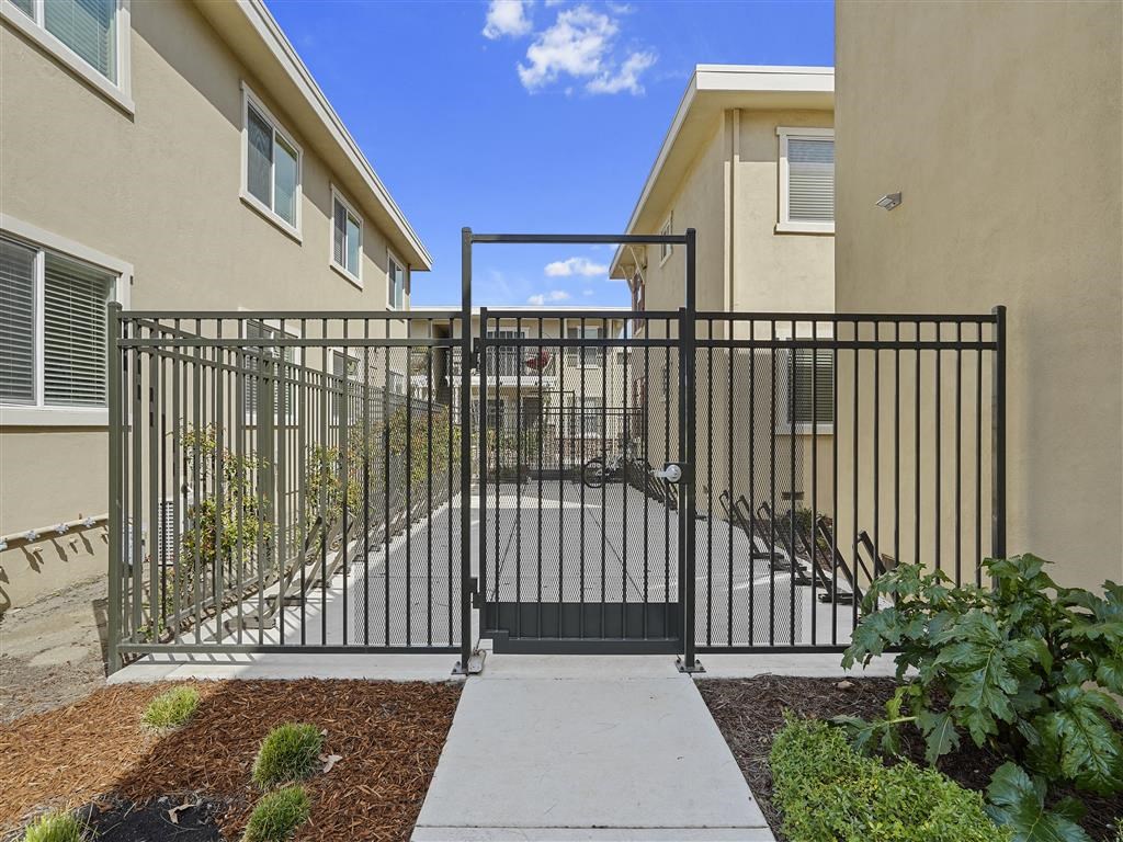 Steel gate and bike racks at Parkside Apartments, Davis, 95616
