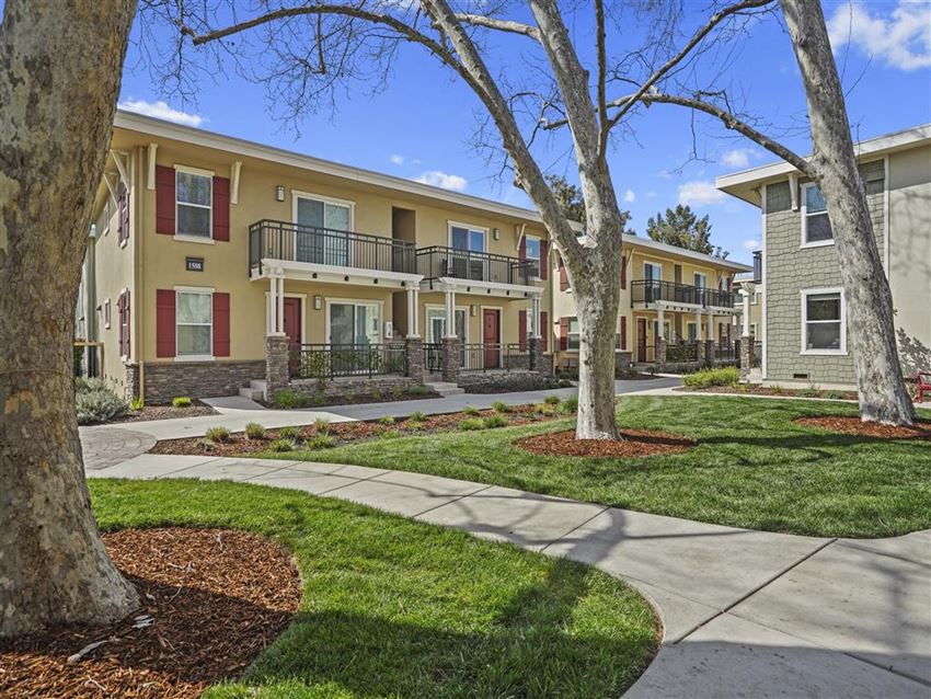 large trees surrounding large trees surrounding at Parkside Apartments, California