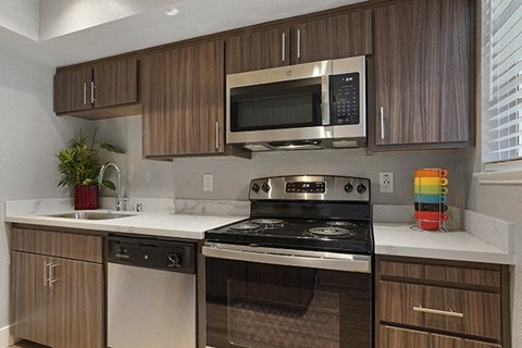 a kitchen with a stove and a microwave