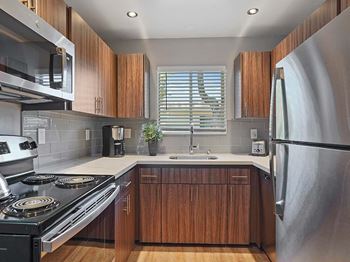 Upscale Stainless Steel Kitchen Appliances With Double Door Refrigerator at Colonial Garden Apartments, San Mateo