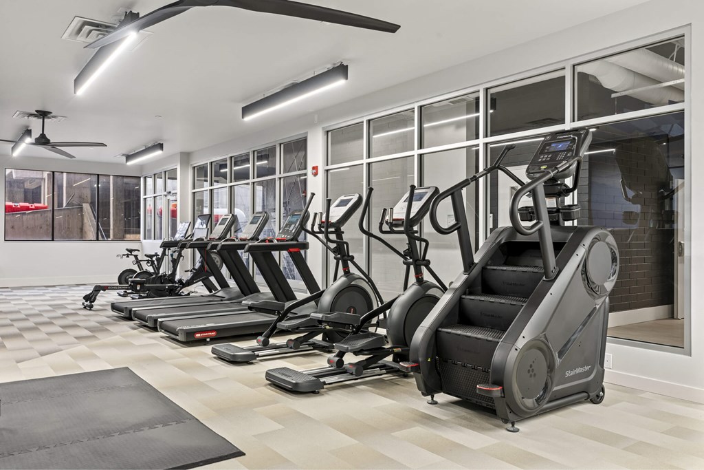 A gym with treadmills and elliptical machines. at Brickside Heights, Millcreek, Utah