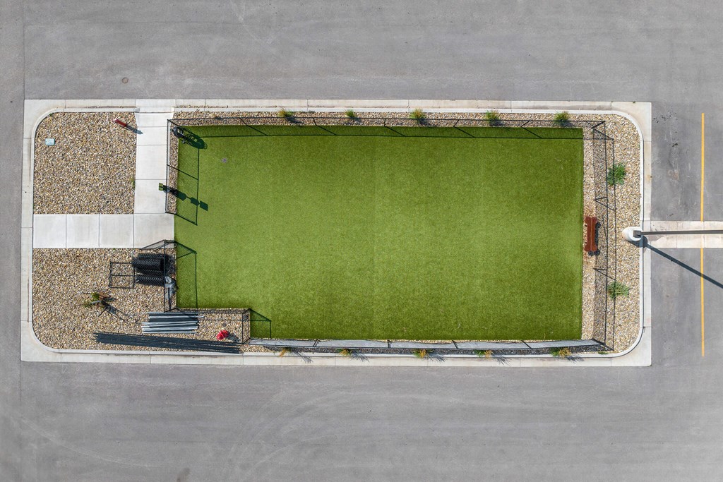 an aerial view of a football field in a parking lot at Red Rock Apartments, Rapid City