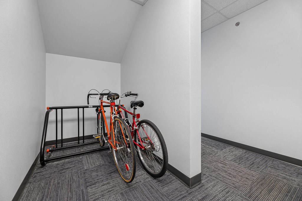 a bike rack in a white room with two bikes on it at Red Rock Apartments, Rapid City, South Dakota