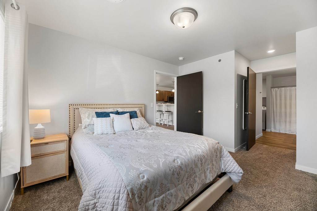 a bedroom with a large bed and a closet at Red Rock Apartments, Rapid City, South Dakota