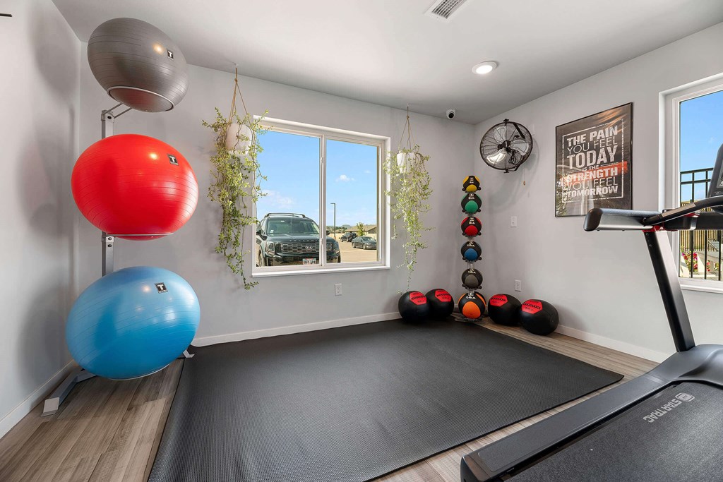 a workout room with a yoga ball and exercise equipment and a window at Red Rock Apartments, Rapid City, SD, 57702