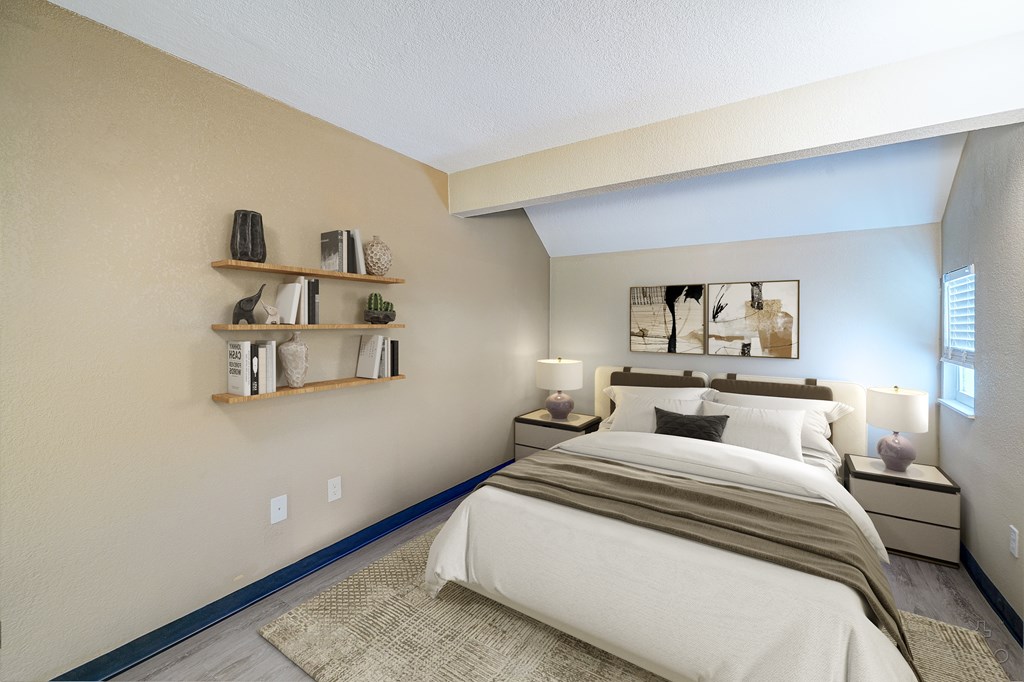 A bedroom with a large bed and a shelf with decorative items.