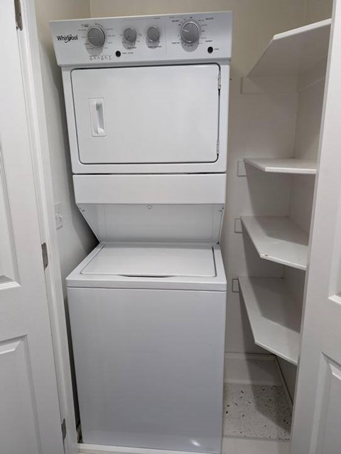 A white Whiting dishwasher and dryer in a kitchen.