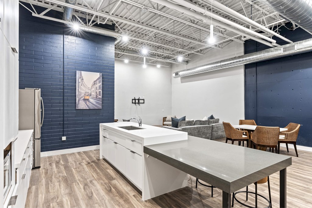 A kitchen with a white countertop and a white refrigerator. at Brickside Heights, Millcreek, UT