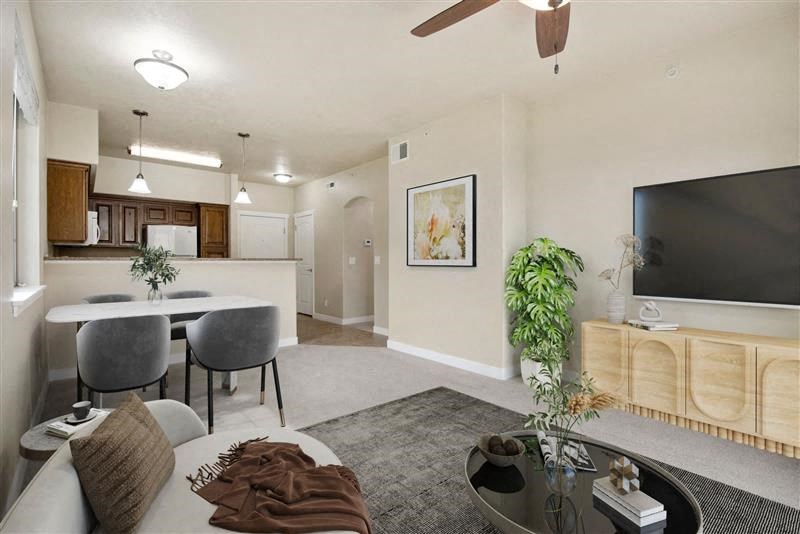a living room with a couch a table and a tv