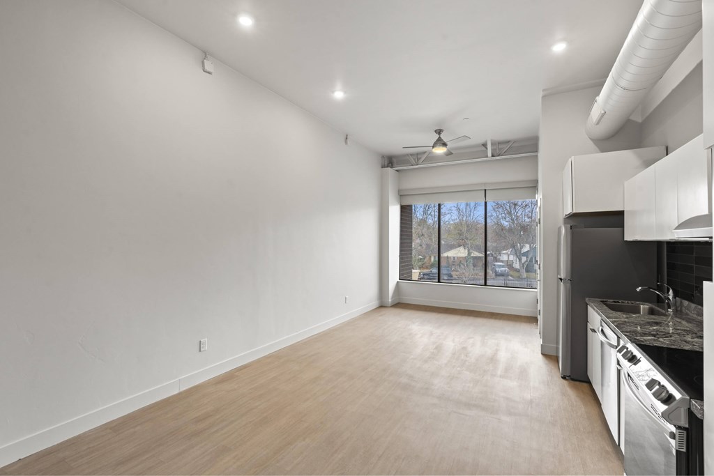 A kitchen with a dining area and a window. at Brickside Heights, Millcreek, UT
