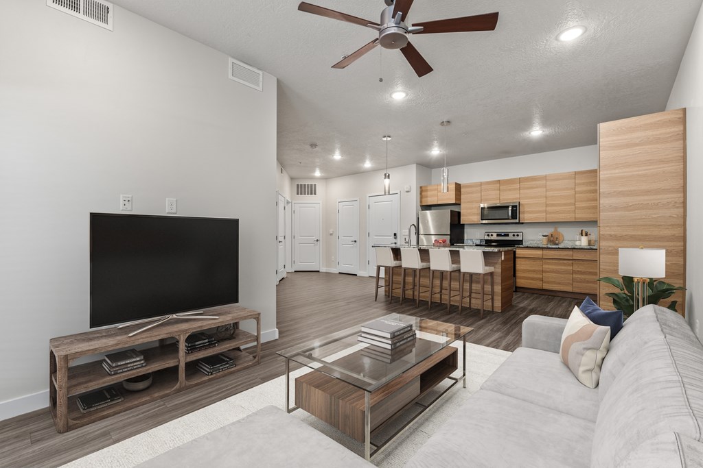 Living Room With TV at The Flats at Riverwoods, Provo