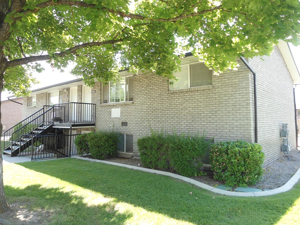 A house with a tree in front of it.