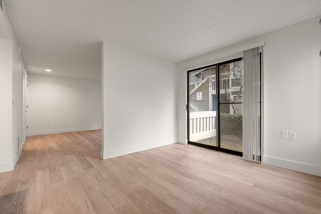 A room with wooden floors and white walls at AVIA Lofts on Parkway Apartments, Vancouver, WA