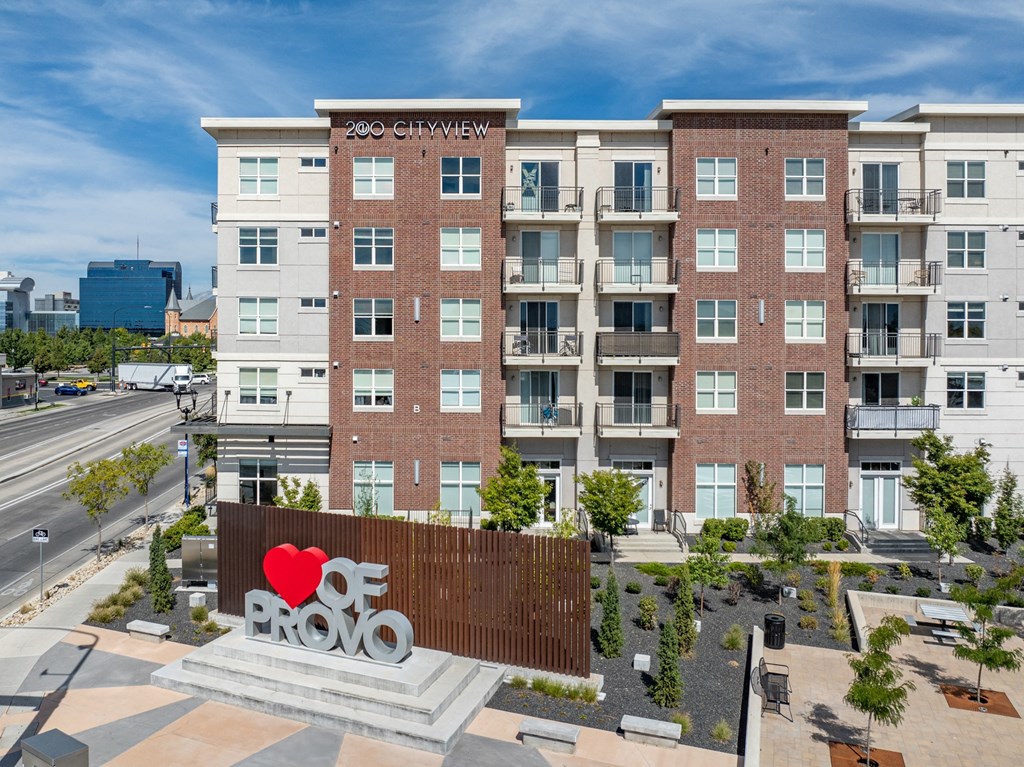 a large sign in front of a building with a red heart on it at 200 City View, Provo, Utah