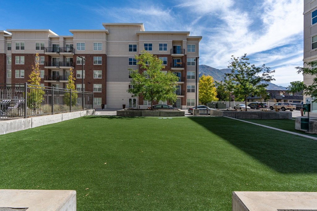 a lawn in front of an apartment building with green grass at 200 City View, Provo, Utah