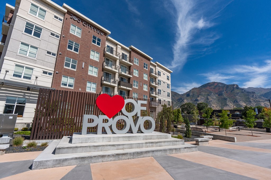 a large red love heart sculpture in front of a building with the word roo a large red love heart sculpture in front of a building with the word roo at 200 City View, Provo
