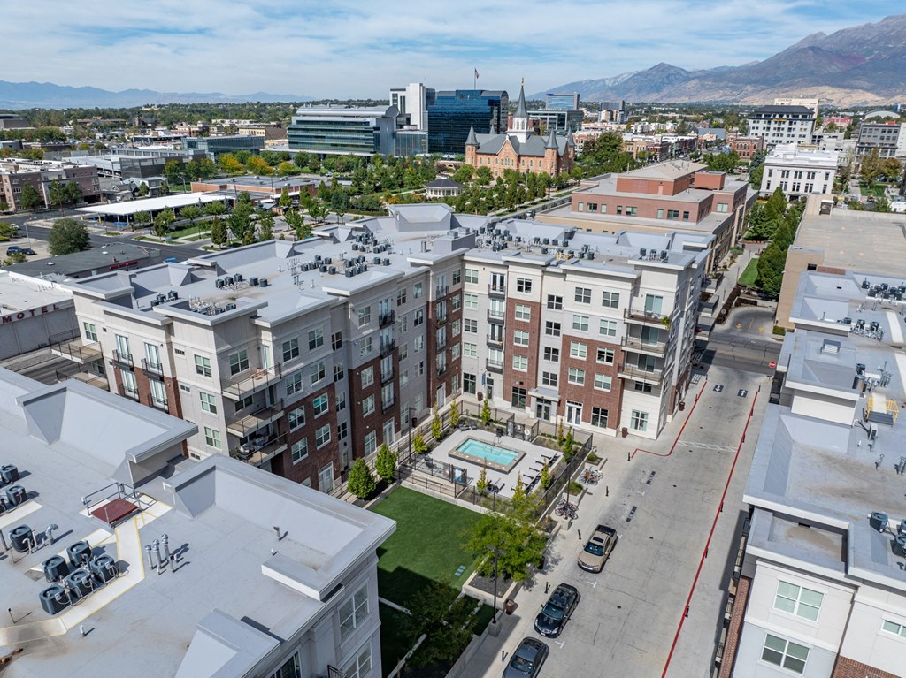 an aerial view of a city with a pool and buildings an aerial view of a city with a pool and buildings at 200 City View, Provo