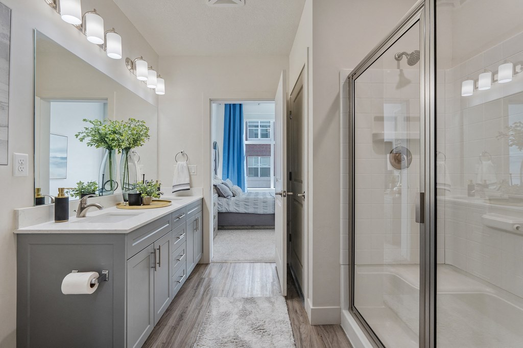 a bathroom with a shower and a sink and a mirror at 200 City View, Utah