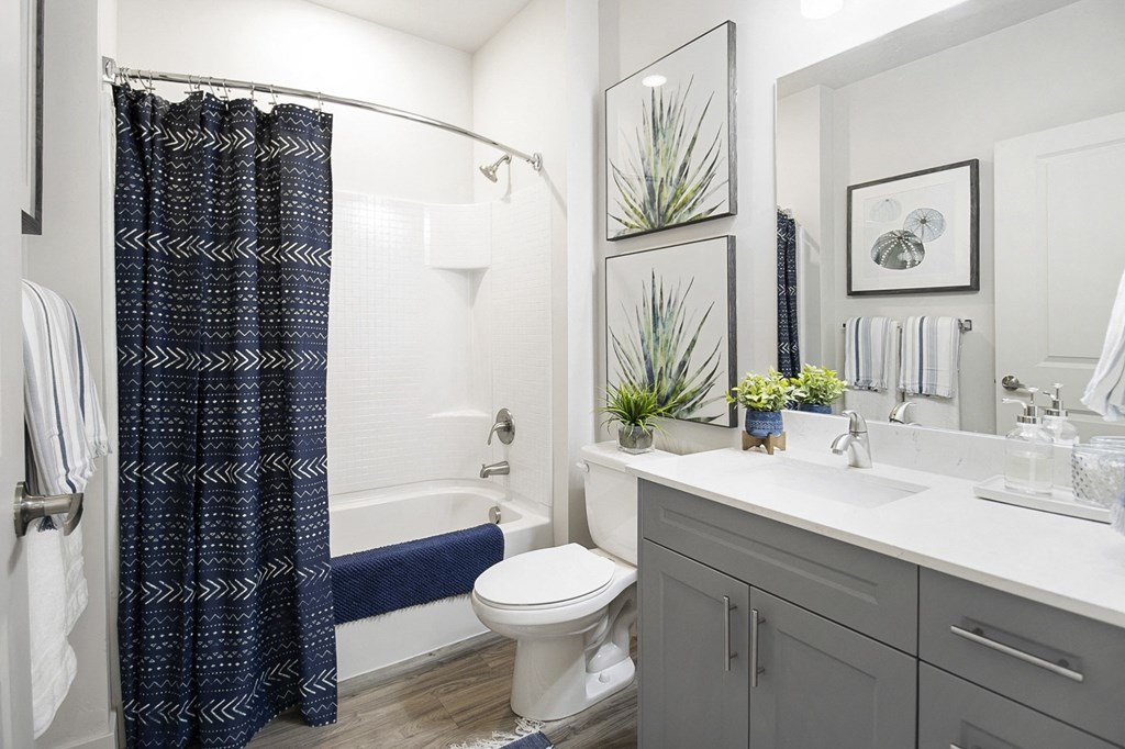 a bathroom with white walls and a black and white shower curtain at 200 City View, Utah, 84601