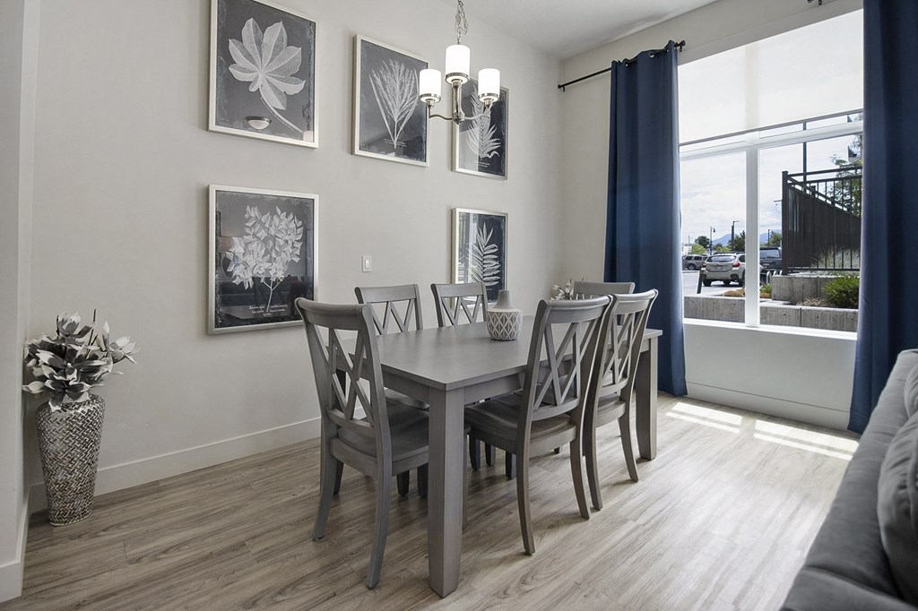 a dining room with a table and chairs at 200 City View, Provo, UT
