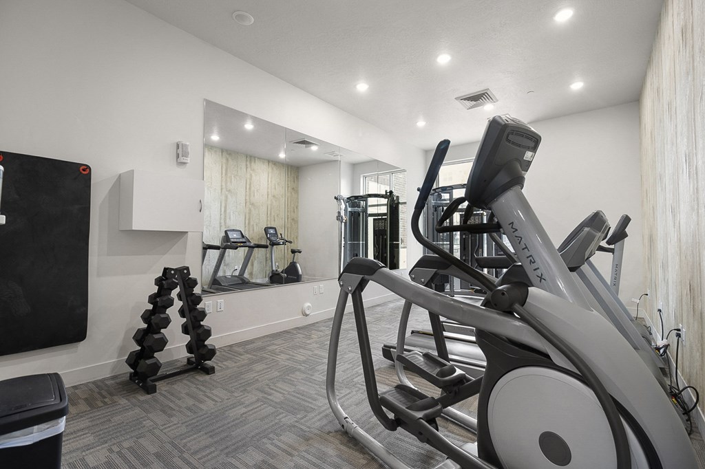 a gym with cardio equipment and weights at 200 City View, Provo, Utah