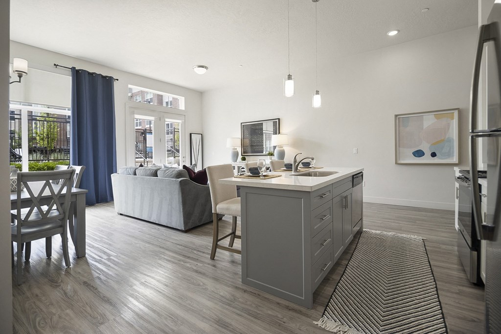 a kitchen and living room with a large window at 200 City View, Provo, UT