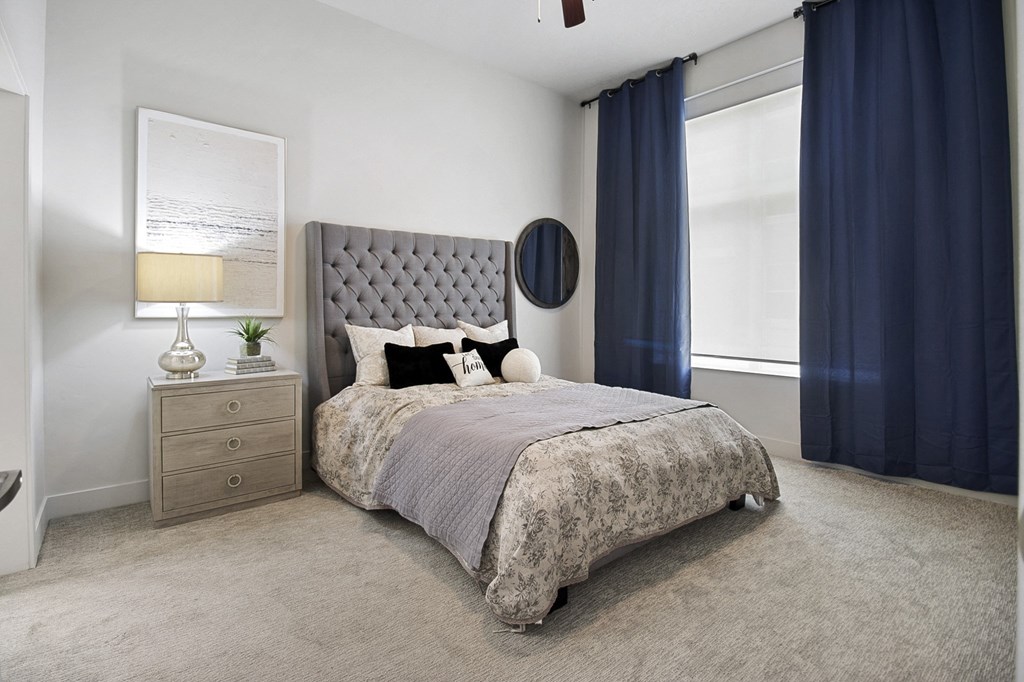 a bedroom with a bed and a dresser at 200 City View, Provo, 84601