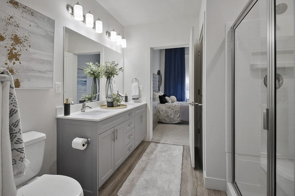 a bathroom with gray cabinets and white walls at 200 City View, Utah, 84601