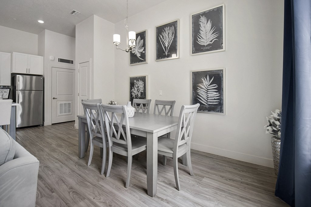 a dining room with a table and chairs at 200 City View, Provo