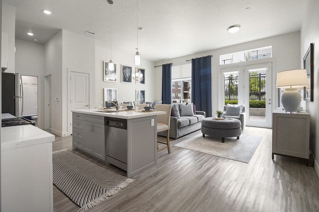 a kitchen and living room with a view of a patio at 200 City View, Provo