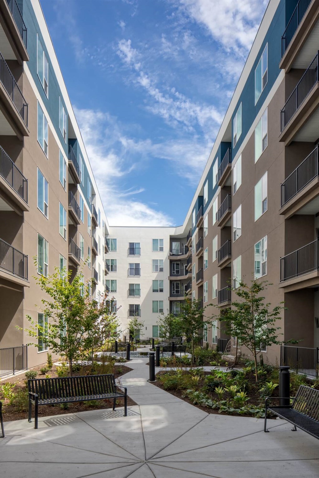 Courtyard with benches ground level at SevenO2 Main Apartments, Salt Lake City, UT