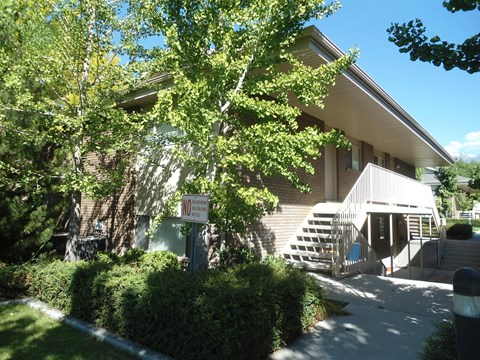 A building with a sign that says "Wi" in front of it.