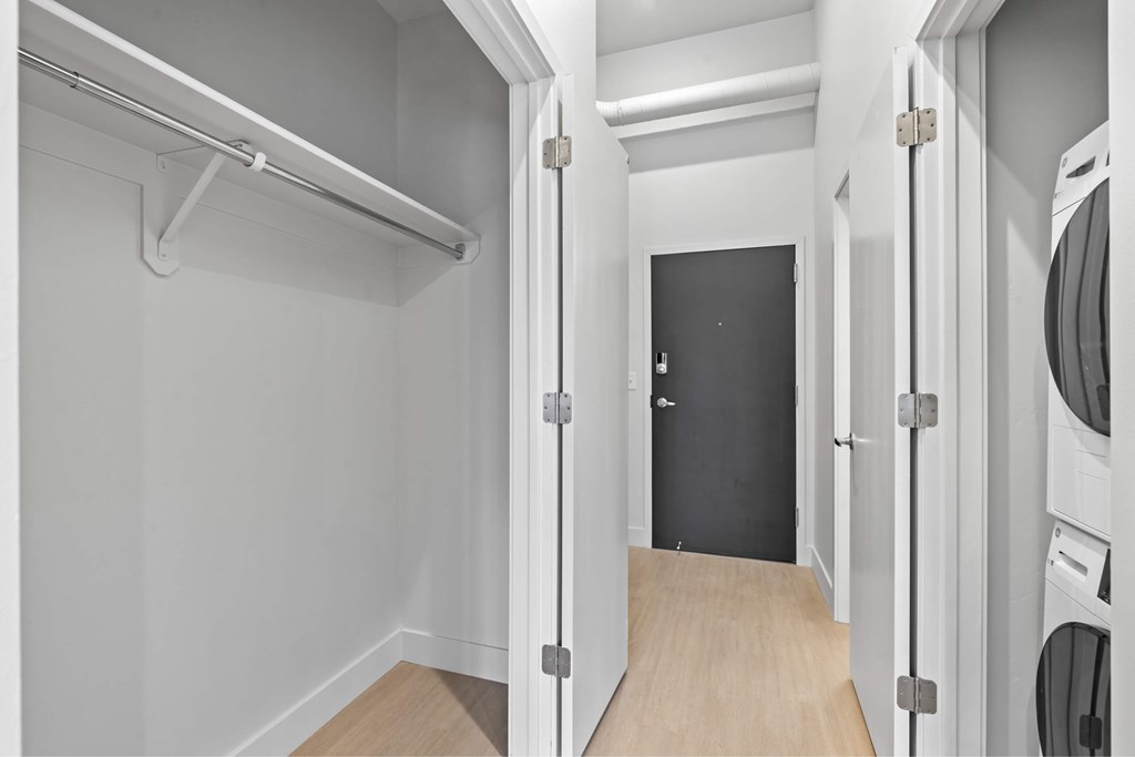 A laundry room with a washer and dryer. at Brickside Heights, Millcreek, UT