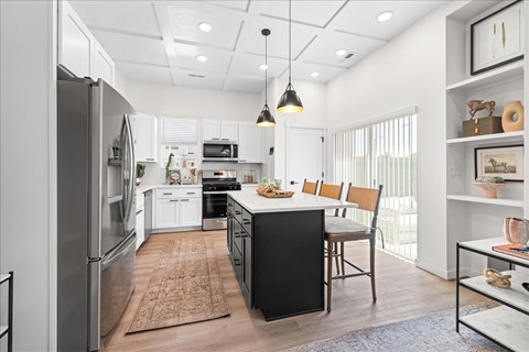 Kitchen With White Cabinetry And Black Appliances at Alante Homes at Spring Run, Caldwell, ID, 83607