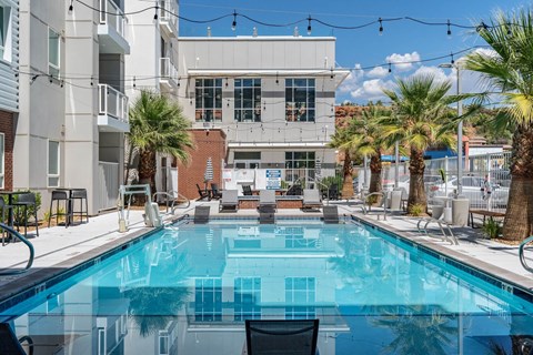 a swimming pool with a building in the background at 605 Place Student Housing & Co-Living, Utah, 84770