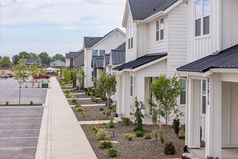 A row of houses with a parking lot in front. at Alante Homes at Spring Run, Idaho