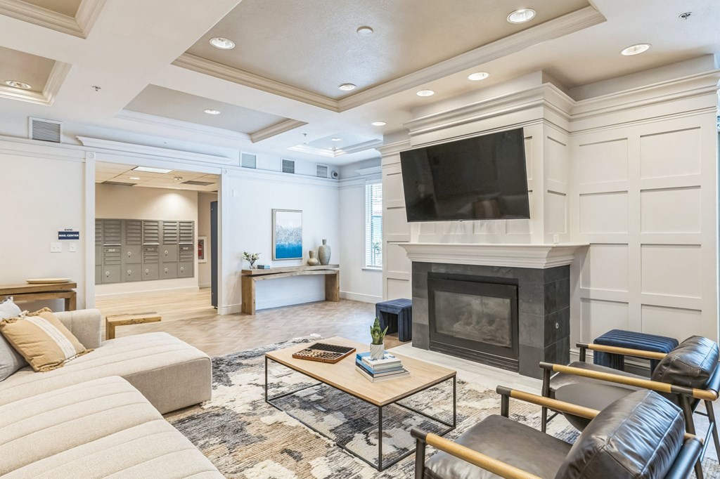 a living room with a tv and a fireplace