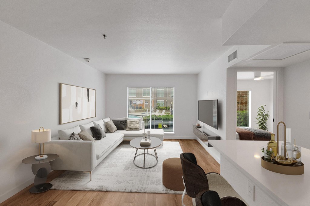 a living room with a couch and a table and a television