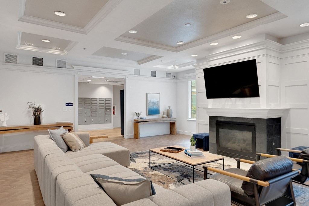 a living room with a large couch and a fireplace