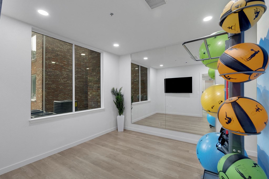the living room is decorated with colorful balls and a large window