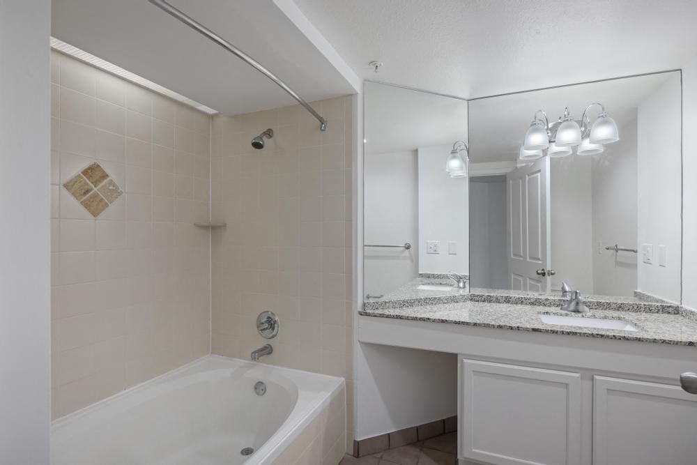 a bathroom with a bathtub and a sink