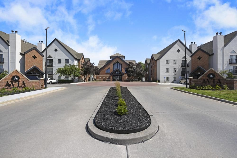 a large empty street with a building in the background